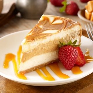 Caramel Swirl Cheesecake: Velvety cheesecake with a rich dulce de leche swirl and caramel sauce.